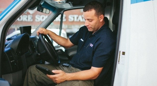 A commercial service technician using ServiceTrade software