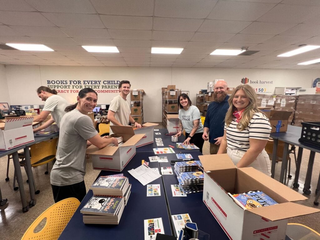 Servicetrade team volunteering at a book harvest book drive