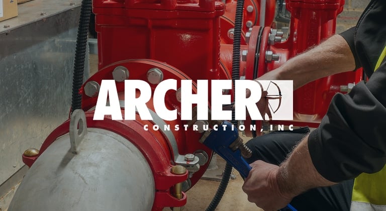 Archer Construction logo on top of mechanical worker